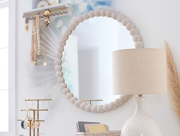 round mirror in beachy room