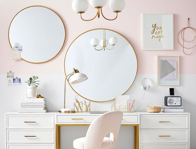 round gold mirrors in pink room