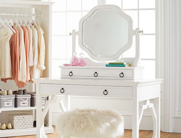white vanity with faux fur chair