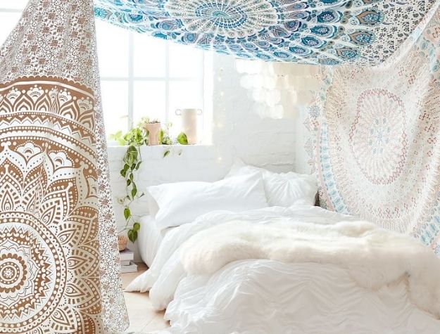 mandala tapestries surrounding bed