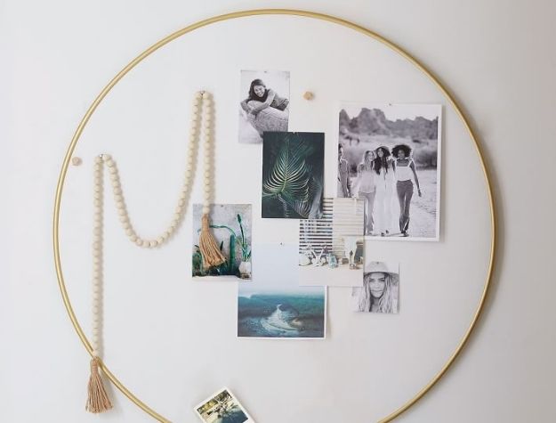 gold framed pinboard with photos