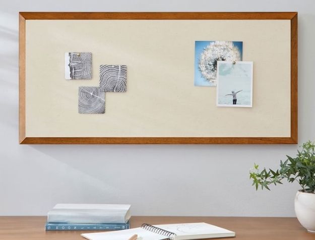 framed pinboard above desk