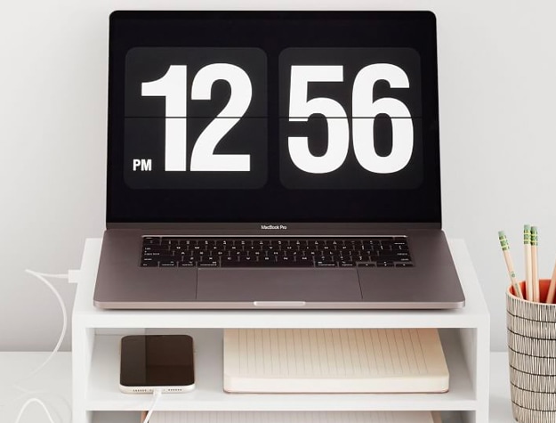 Laptop on white desk riser