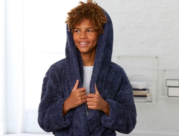 Teen boy in blue sherpa robe