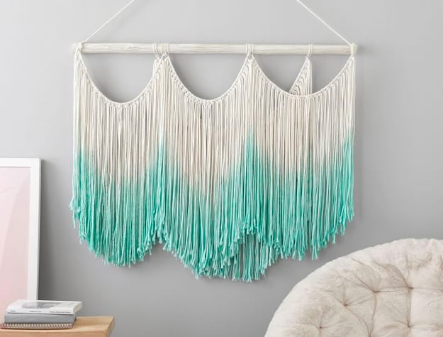 White and blue fringed wall hanging