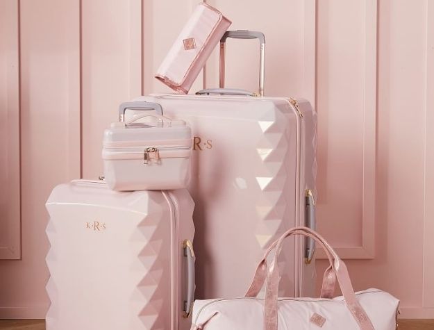 pink luggage set with duffle bag