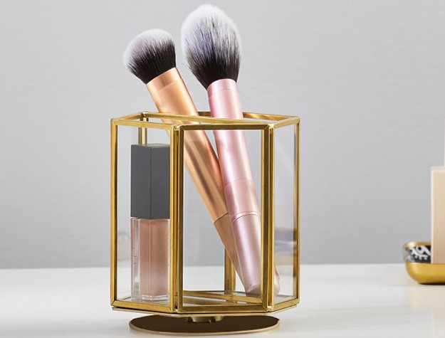 Gold rotating beauty holder with brushes