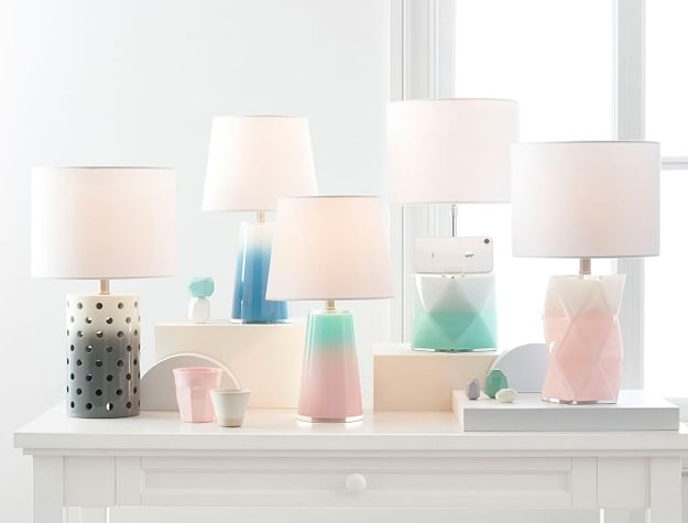 Various plush ombre prism standard table lamps on a table.