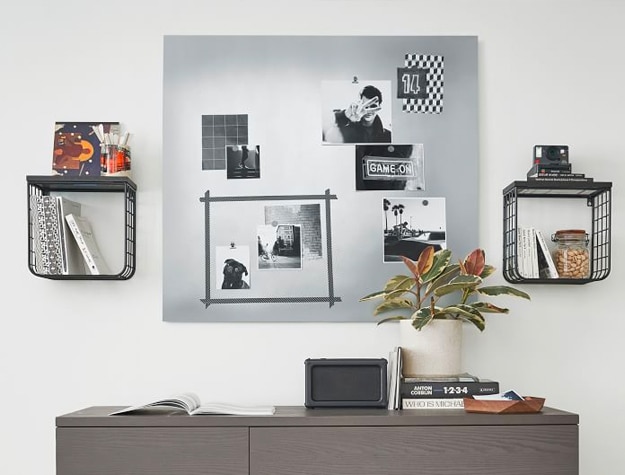 Galvanized Magnet Board hanging on a wall with printed photographs.