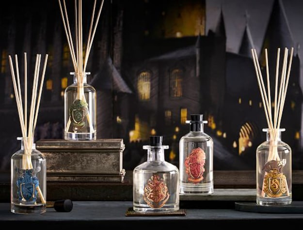 Harry Potter themed reed diffusers sit on top of a table.