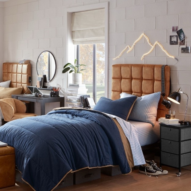 This guy dorm room features underbed storage and nightstand storage. 