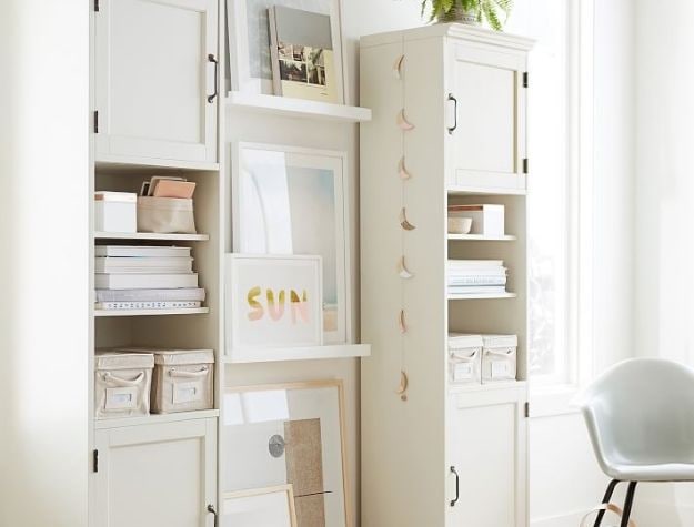 framed photos on floating shelf