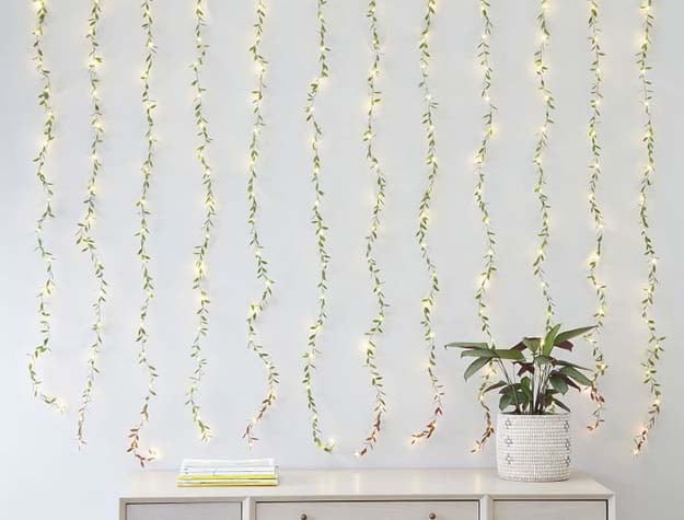 Curtain leaf waterfall string lights hanging on a wall above a dresser