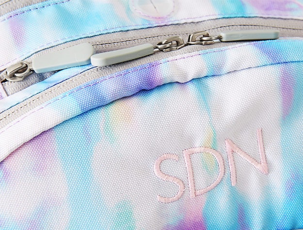 purple blue backpack with monogram