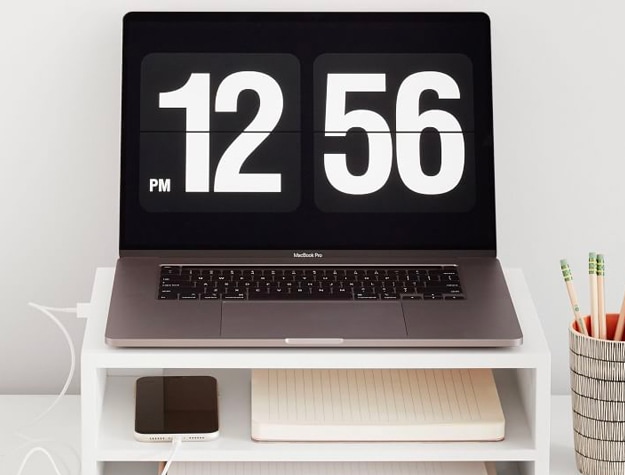 Laptop on white desk riser Laptop on white desk riser