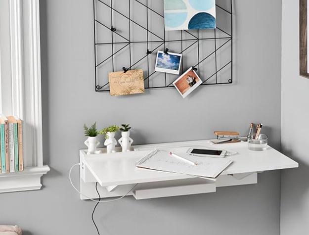 White wall desk with notebook