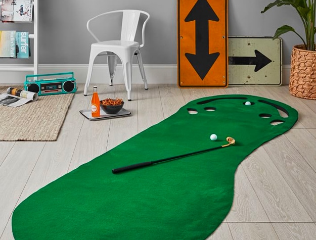 Putting green game in room Putting green game in room