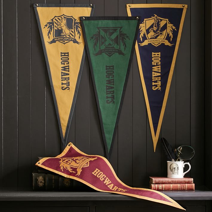 Harry Potter house color balloons and Hogwarts banner first