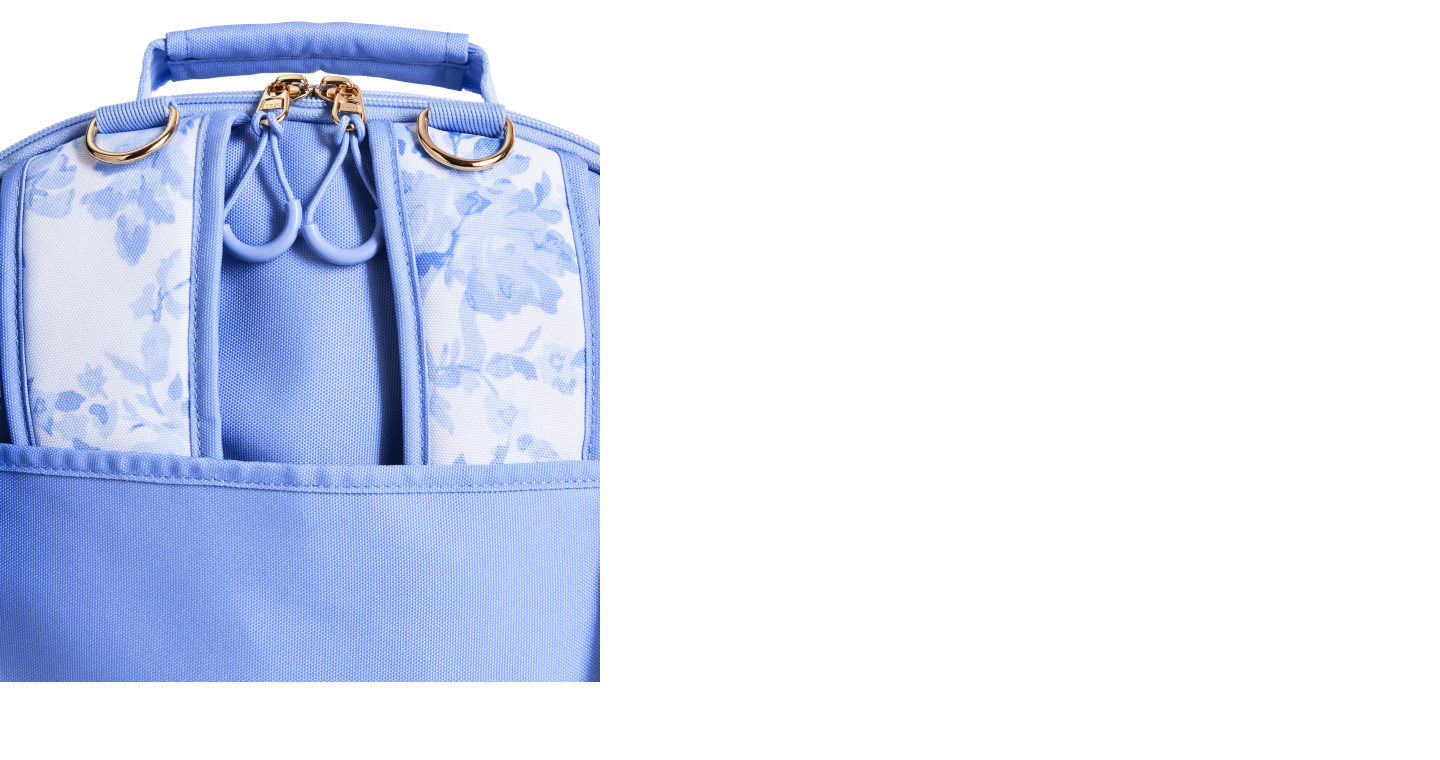 Gallery of five images showing the Gear-Up Adaptive Backpack's main features, including smooth-glide zipper pulls; insulated front pockets; access ports for tubes and cables; a roomy interior with pockets for hanging feeding bags, equipment and school essentials; and versatile mounting options for mobility devices. This image displays the versatile mounting options for mobility devices feature.