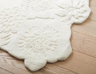 White rug with floral accents